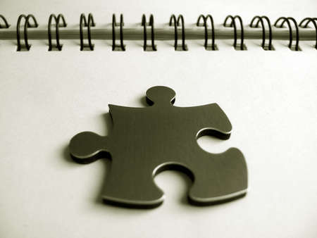 Jigsaw pice on a notebook