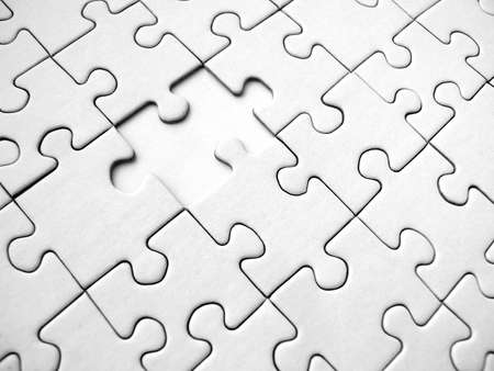 White jigsaw puzzle background (conceptual)の写真素材