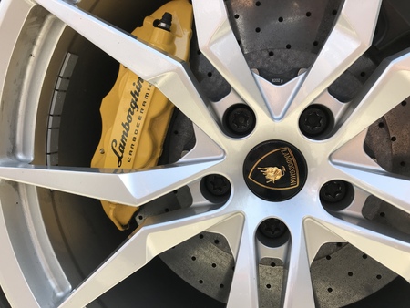 Marbella, Spain - August 10, 2018: Logo of a Lamborghini car parked inside the famous Puerto Banus. Luxury port where you can take a walk, have a drink and see large and luxurious yachtsのeditorial素材