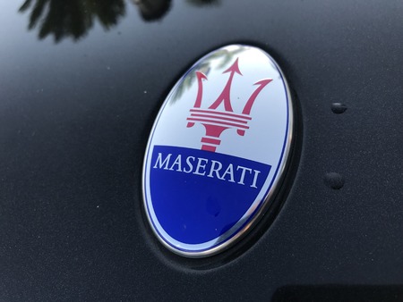 Marbella, Spain - August 10, 2018: Logo of a Maserati car parked inside the famous Puerto Banus. Luxury port where you can take a walk, have a drink and see large and luxurious yachtsのeditorial素材