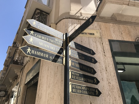 Malaga, Spain - August 9, 2018: View of an information post with several arrows that point to places in the center of the city of Malagaのeditorial素材