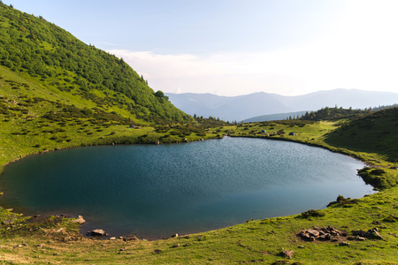 Sunset near a picturesque lake in the mountains vacationの写真素材