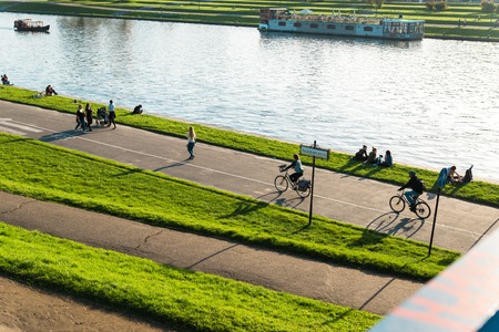 Krakow, Poland -October 17, 2017: People enjoy the beautiful sunset and do sports on the river Vistula, Poland Krakowのeditorial素材