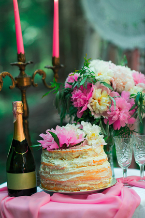 beautiful wedding decorations champagne flowers and cakeの写真素材