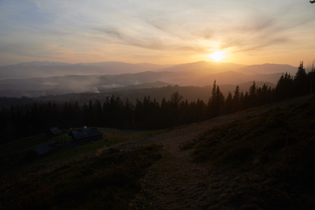 A lovely orange sunset in the summer mountainsの写真素材