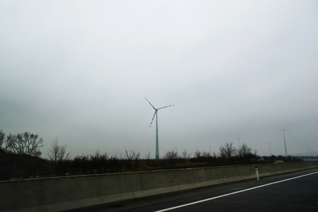 wind turbines on the background of smog, Eco power conceptの写真素材