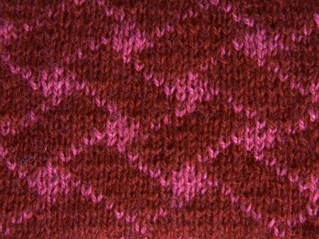Red background of soft, fleecy cloth. Texture of nappy textileの写真素材