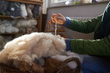 handmade manufacturing yarns from natural sheep woolの写真素材