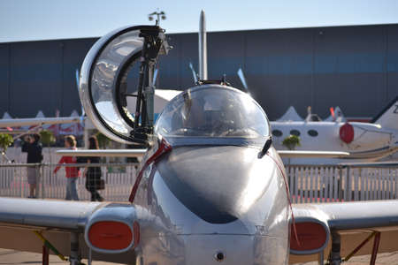 Old fighter jet on display with canopy openの写真素材