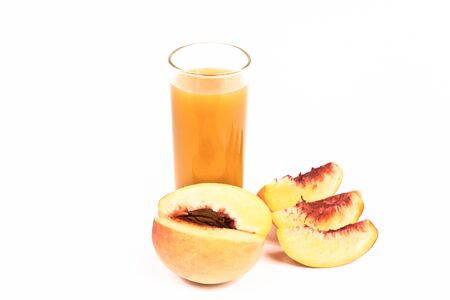 Peach juice on a white background.の写真素材