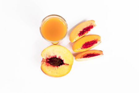 Peach juice on a white background.の写真素材