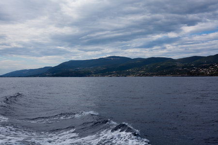 View from the boat on the sea and mountains in the background.の写真素材