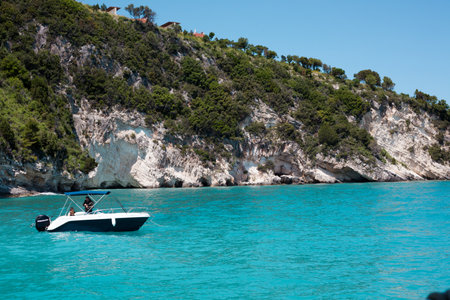 Boat on the turquoise water of the Adriatic Sea in Croatiaの写真素材