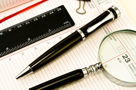 Pen and Agenda with a tools of punctualityの写真素材