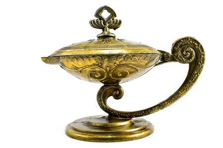Antique oil lamp isolated on whiteの写真素材