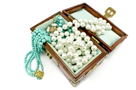 Wooden treasure chest with jewelry isolated on whiteの写真素材
