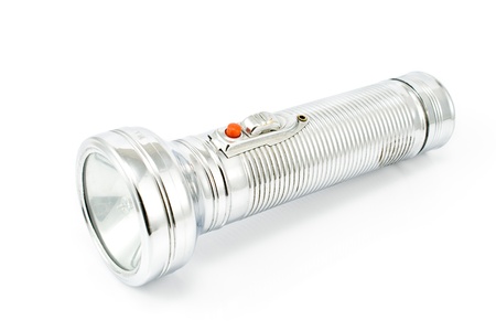 Old metal flashlight isolated on whiteの写真素材