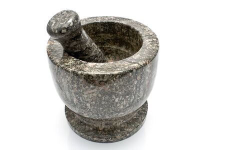 Granite mortar and pestle isolated on whiteの写真素材