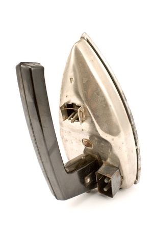 Old electric iron isolated on whiteの写真素材
