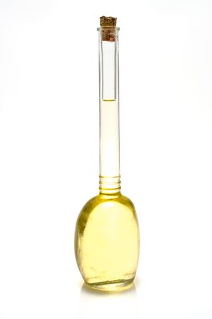 Glass bottle of sunflower oil isolated on whiteの写真素材