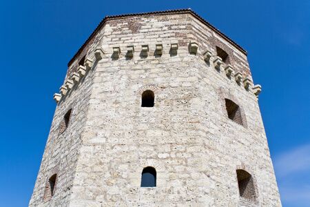 Old tower of Belgrade fortress over blue skyの写真素材