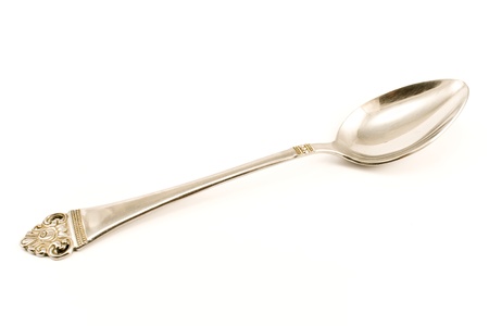 Metal spoon isolated on  whiteの写真素材