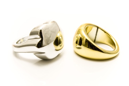 Silver and gold rings isolated on whiteの写真素材
