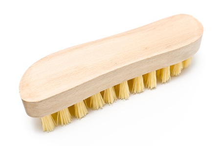 Wooden scrub brush with yellow bristles isolated on whiteの写真素材
