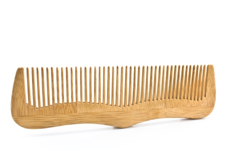 Wooden comb isolated on whiteの写真素材