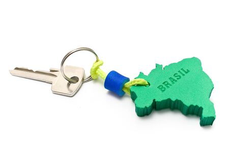House key with tag in form of  Brazil border isolated on whiteの写真素材