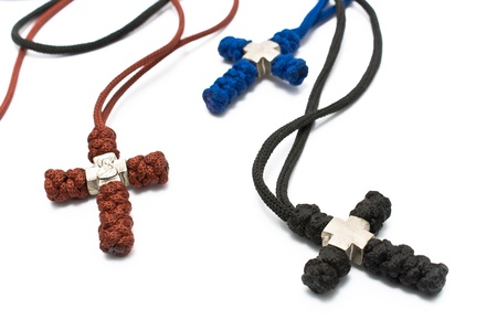 Three knitted christian crosses isolated on whiteの写真素材