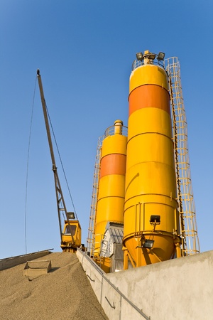 Yellow concrete silos over blue skyの写真素材