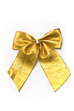 Golden gift bow ribbon isolated on whiteの写真素材