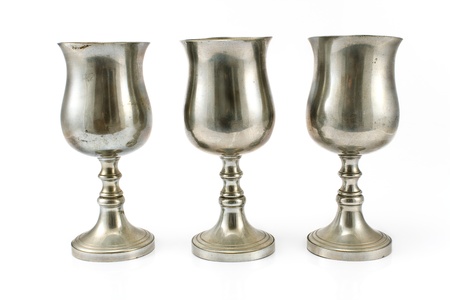 Three vintage silver plated goblets isolated on whiteの写真素材