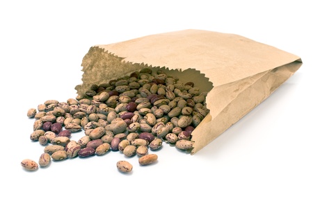 Cranberry bean in paper bag isolated on white の写真素材