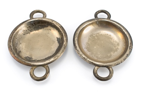 Two antique silver ashtrays isolated on whiteの写真素材