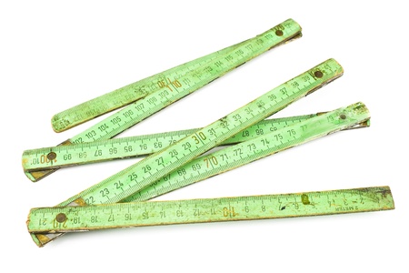 Old carpentry ruler isolated on whiteの写真素材