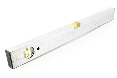 Used old construction spirit level isolated on whiteの写真素材