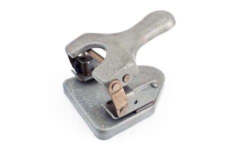 Vintage office paper hole puncher isolated on whiteの写真素材