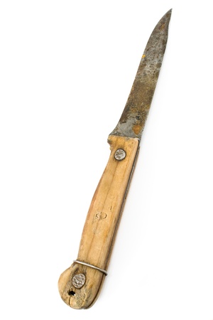 Old rusty knife with wooden handle isolated on whiteの写真素材