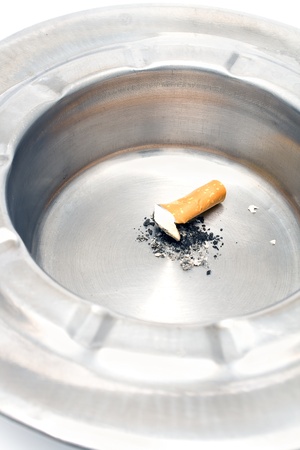 Cigarette butt in a metal ashtrayの写真素材
