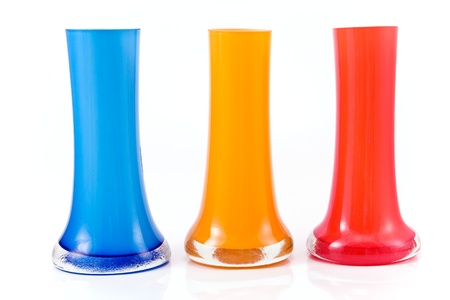 Three colorful glass vases isolated on whiteの写真素材