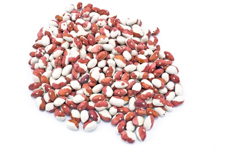 Pile green calypso beans on white background