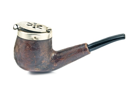 Old tobacco pipe with metal lid isolated on whiteの写真素材