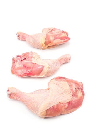 Raw chicken legs isolated on whiteの写真素材