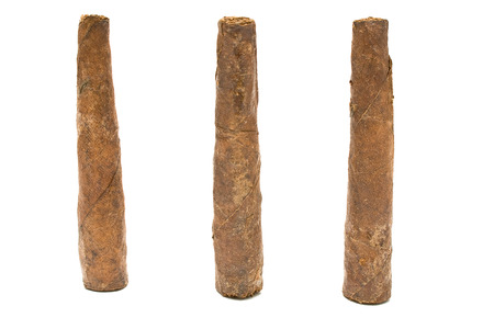 three cigars isolated on whiteの写真素材