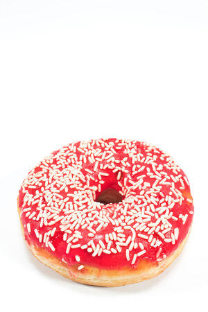 Donut with sprinkles isolated on whiteの写真素材