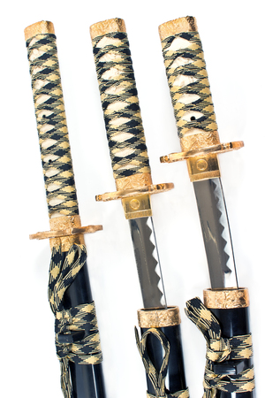 Three Japanese samurai katana swords over whiteの写真素材