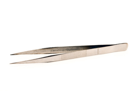 Metal tweezers isolated on white