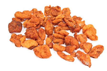 Heap of fried pork greaves isolated on whiteの写真素材